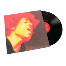 Load image into Gallery viewer, Vinyl record with a colorful cover featuring a face design on a white background