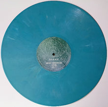 Charger l'image dans la galerie, Blue vinyl record with a label on a white background