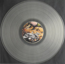 Cargar imagen en el visor de la galería, Vinyl record with a cover featuring a futuristic vehicle on a dark background