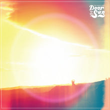 Load image into Gallery viewer, A colorful sunset with a silhouette of a person standing on a hill, with the text 'Door of the Sun' overlaid at the top.