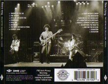 Cargar imagen en el visor de la galería, Back cover of a Thin Lizzy 'The Definitive Collection' music compilation CD case, showing a black-and-white concert stage scene with band members, track listings, and barcode information.