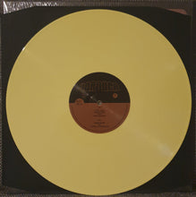 Load image into Gallery viewer, Yellow vinyl record with a black label inside, still in its packaging.