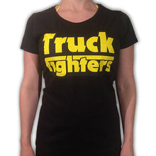 Cargar imagen en el visor de la galería, Black t-shirt with yellow &#39;Truck Fighters&#39; text worn by a person on a white background