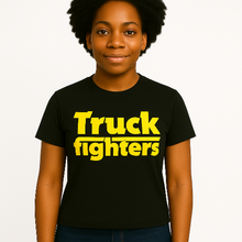 Cargar imagen en el visor de la galería, Person wearing a black t-shirt with &#39;Truck fighters&#39; in yellow text on a plain background