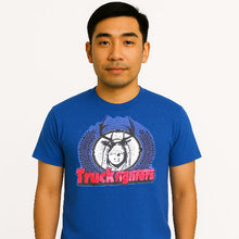 Cargar imagen en el visor de la galería, Man wearing a blue t-shirt with &#39;Truckfighters&#39; graphic design on a white background