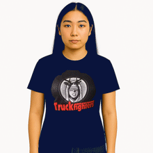 Cargar imagen en el visor de la galería, Person wearing a navy blue t-shirt with &#39;Truckfighters&#39; graphic design on a white background
