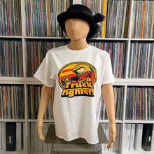 Load image into Gallery viewer, Mannequin wearing a white t-shirt with a graphic design in front of a bookshelf filled with records.