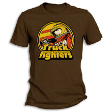 Load image into Gallery viewer, A brown t-shirt with a graphic print of a spacefighter and the text &#39;TRUCK FIGHTERS&#39;.
