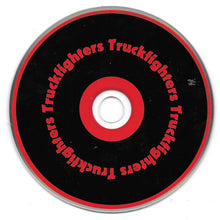 Cargar imagen en el visor de la galería, A circular black disc with a red ring and red text reading 'Truckfighters' repeated around the edge, shown on a white background.