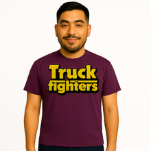 Cargar imagen en el visor de la galería, Man wearing a purple t-shirt with &#39;Truck fighters&#39; text on a white background