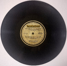 Load image into Gallery viewer, A black vinyl record with a cream-colored center label featuring the Truckers band name and song titles, photographed against a plain off-white background.
