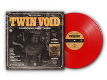 Load image into Gallery viewer, The cover art for the Twin Void album 'Free From Hardtimes' features a black and white photograph of a person sitting in a chair with a guitar, with album details and band branding overlay.