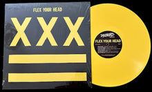 Cargar imagen en el visor de la galería, A yellow vinyl record partially pulled from its black sleeve, which features large yellow 'XXX' lettering and yellow horizontal stripes on a black background. The center label reads 'Dischord' and 'Flex Your Head'.