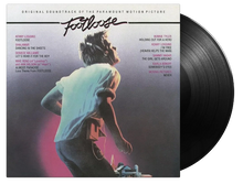 Load image into Gallery viewer, Vinyl record with 'Footloose' soundtrack cover showing a person running.