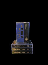 Cargar imagen en el visor de la galería, Clear transparent acrylic stand with a blue cassette tape on top, set against a black background.