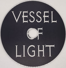 Cargar imagen en el visor de la galería, Black disc with 'Vessel of Light' text on a white background
