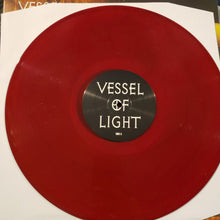 Cargar imagen en el visor de la galería, Red vinyl record with 'Vessel of Light' label on a white background