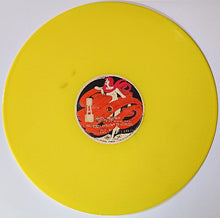Load image into Gallery viewer, Yellow vinyl record with a red and black label featuring a stylized woman.