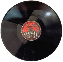 Charger l&#39;image dans la galerie, Vinyl record with a red label on a white background