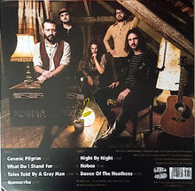 Charger l'image dans la galerie, Album cover with band members in a room with lamps and a guitar