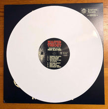 Load image into Gallery viewer, Vinyl record with a black label on a wooden surface