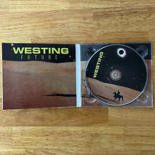 Charger l'image dans la galerie, CD cover with 'Westing' branding on a wooden surface