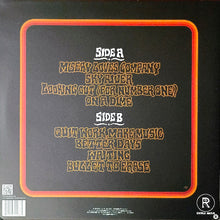 Charger l'image dans la galerie, Back cover of a vinyl record with text and a red border