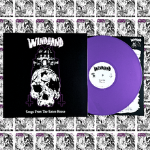 Charger l'image dans la galerie, The product image features the album cover of "Windhand - Songs From The Satan House" on vinyl. It displays a graphic design of a skull and crossbones above a haunted house, rendered in white and purple against a black background.