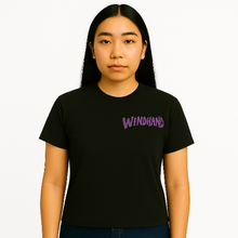 Load image into Gallery viewer, Person wearing a black t-shirt with &#39;WINDHAND&#39; in purple text on a white background