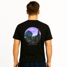Load image into Gallery viewer, Person wearing a black t-shirt with a circular design on the back, featuring trees and a purple sky.