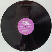 Cargar imagen en el visor de la galería, Vinyl record with a pink label on a white background