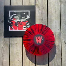 Cargar imagen en el visor de la galería, Wolves In Haze - Chaos Reigns splattered vinyl record.