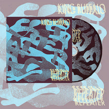 Cargar imagen en el visor de la galería, Stylized album artwork featuring abstract, wavy blue shapes layered over a muted background, with a CD partially visible beside a square album cover. The text “King Buffalo” appears at the top and “Repeater” at the bottom in a rough, hand-drawn style.