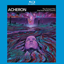Load image into Gallery viewer, Blu-ray cover art for “Acheron – The Concert Film Live from Howe Caverns” by King Buffalo, featuring a surreal, psychedelic scene of a woman’s face emerging from swirling, cosmic-colored liquid with purple, pink, and blue tones, distant rocky formations, and a glowing vortex in the sky.