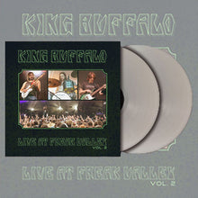 Cargar imagen en el visor de la galería, Album artwork and double vinyl records for King Buffalo’s 'Live at Freak Valley Vol. 2.' The black cover features four rectangular photos: three individual shots of band members performing and one wide-angle shot of a cheering concert crowd. Two metallic silver vinyl records are shown partially sliding out from behind the right side of the sleeve. The band name and album title are written in a stylized, jagged font at the top and bottom.