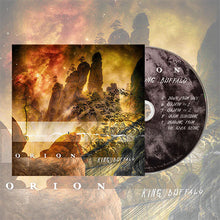 Load image into Gallery viewer, The image depicts a surreal, cosmic desert landscape featuring towering rock monoliths under a swirling, nebula-filled sky. A smaller version of the cover is placed over the main background, and a CD showing a partial tracklist—including songs like "Down From Sky" and "Goliath Pt. 1"—is visible on the right.