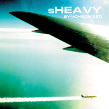 Cargar imagen en el visor de la galería, Album cover with a silhouette of an airplane flying over water, featuring the text 'sHEAVY Synchronized'.