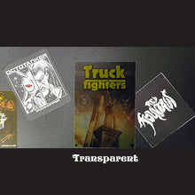 Load image into Gallery viewer, Collection of transparent stickers with various designs on a dark background